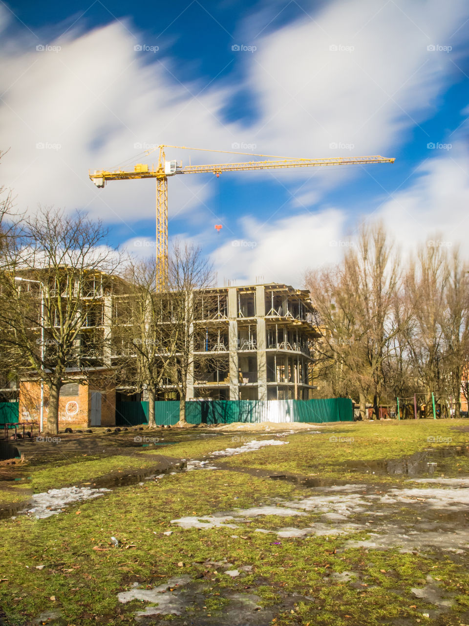 building process with crane on long exposure