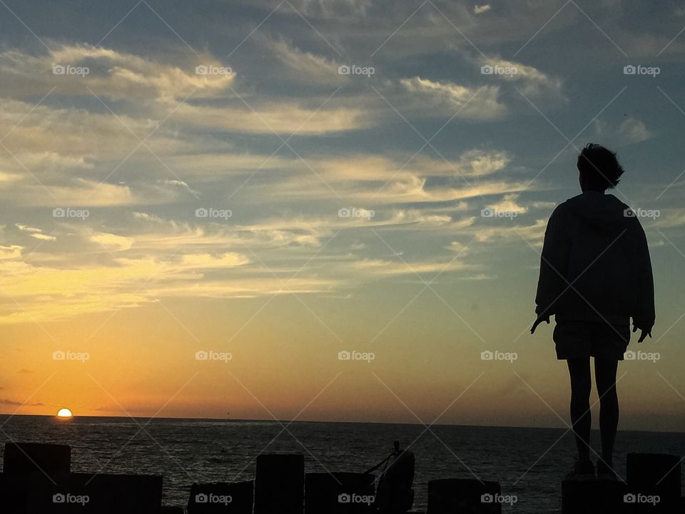 Looking at the sunset Redondo beach , California 