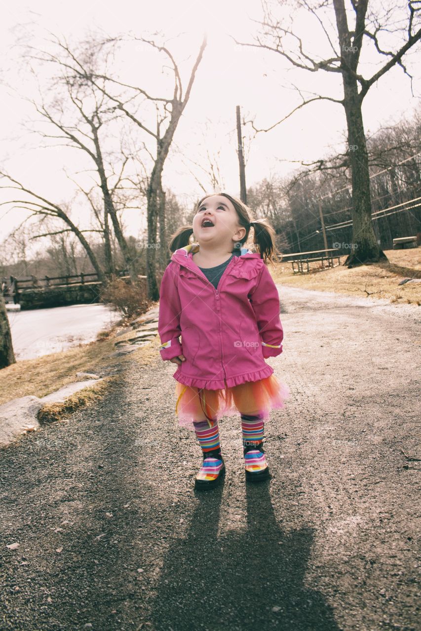 Little girl looking up at path