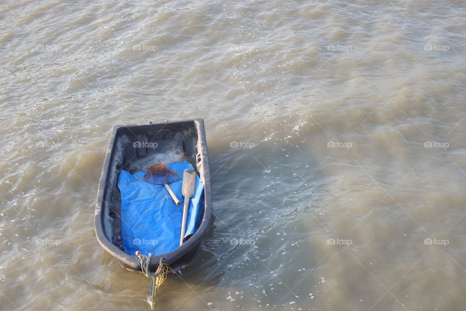 Small boat in a rough sea