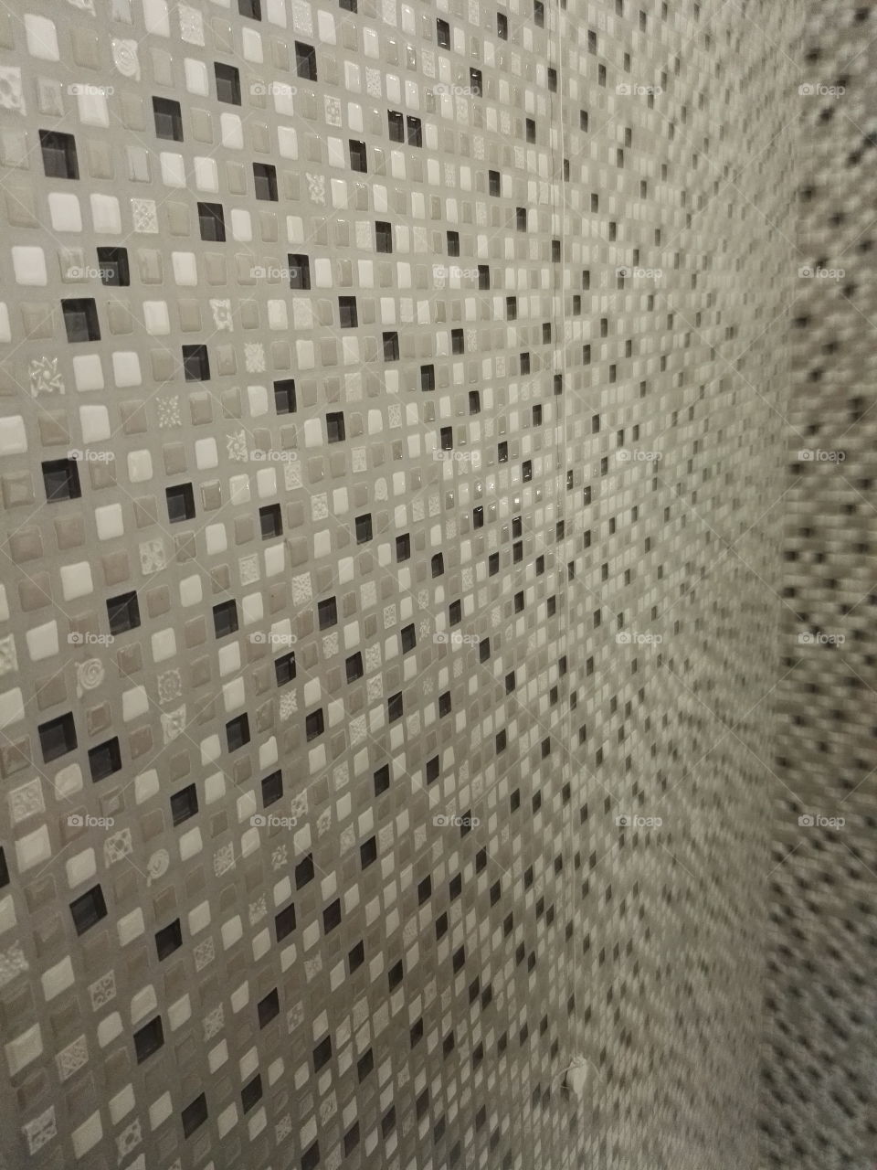 the wall tiles in shades of gray