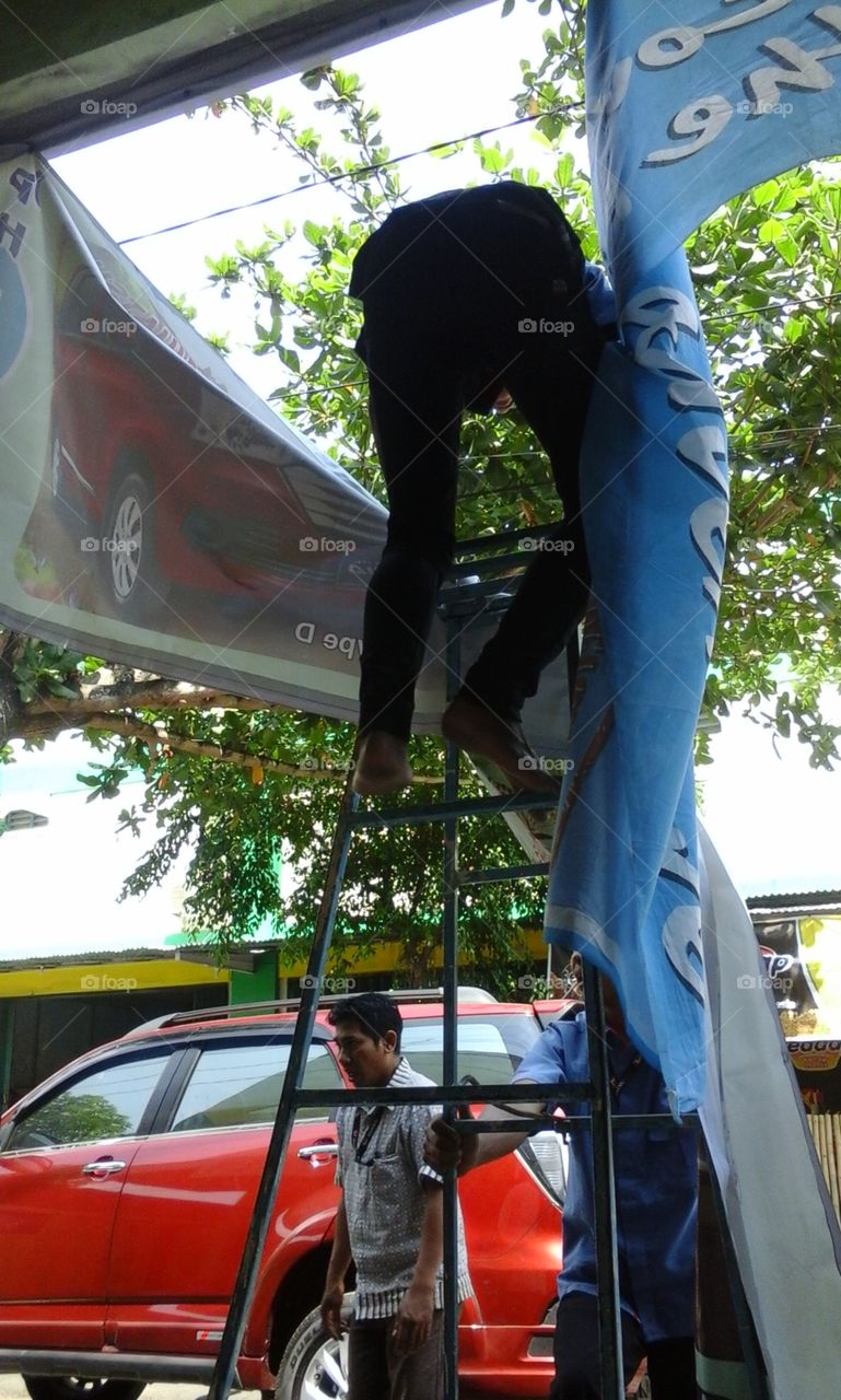 repair banner. man repair banner on the kiosk