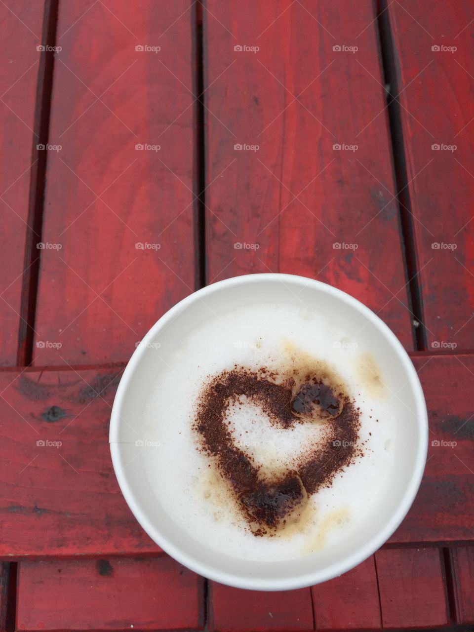 Cup of coffee with chocolate Heart On a wooden table - in Germany