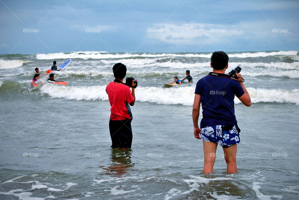 Photographer at a surfing beach