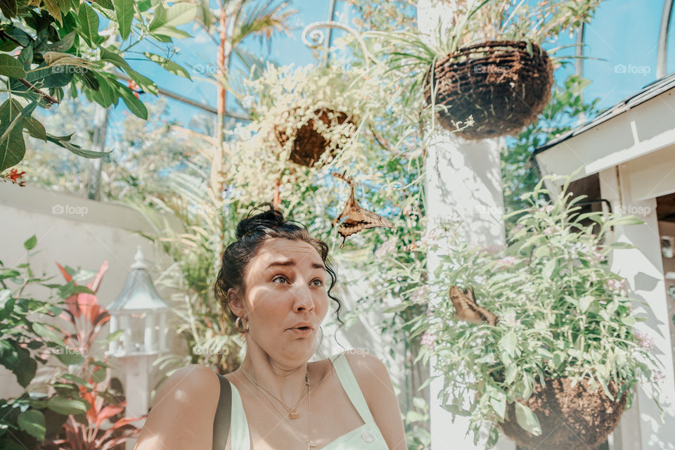 Girl being attacked by flying butterflies