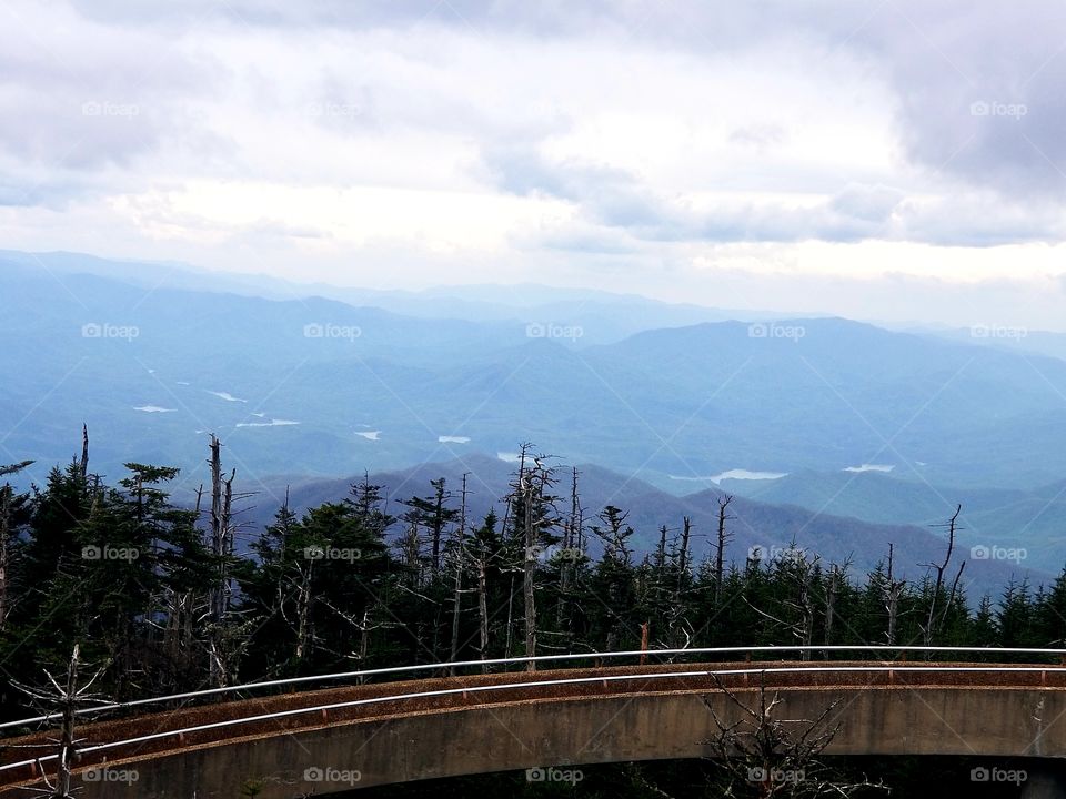 Breathtaking panoramic sweeping views from Clingmans Dome in the Smoky Mountain national park/forest with rolling clouds over North Carolina & Tennessee.