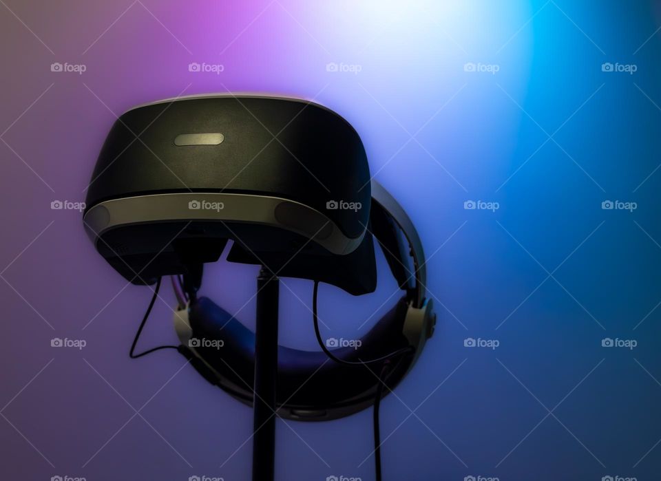 PlayStation VR headset under coloured lighting