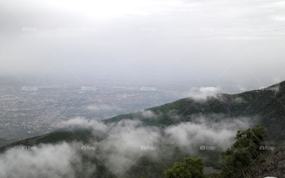 view over the clouds and he city if Napoli, from Vulcan Vesuvius, southern Italy