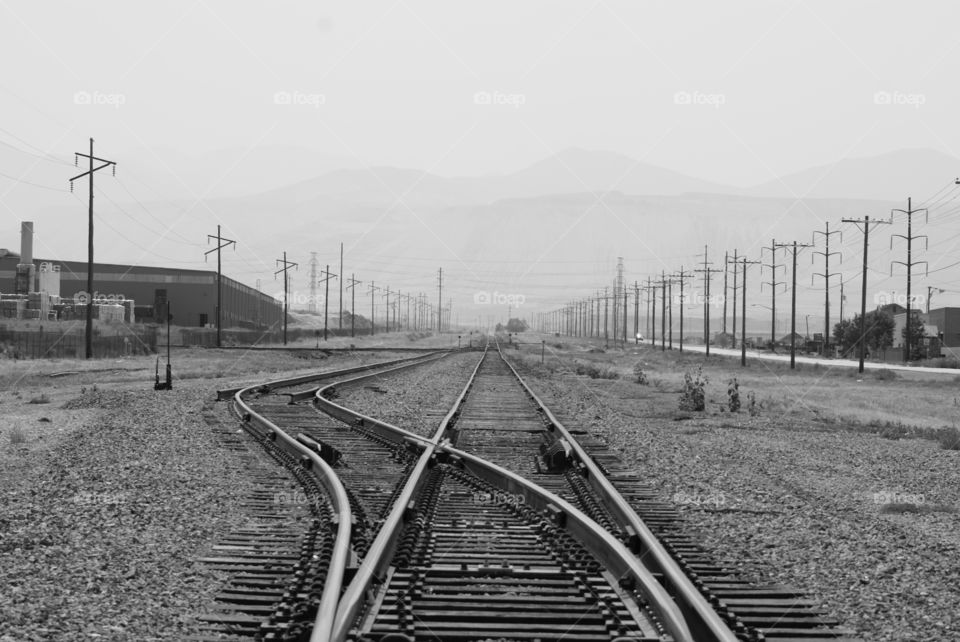 Electricity pylon and railroad tracks