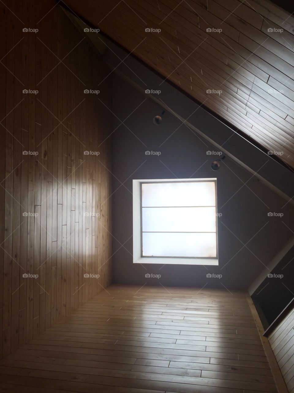 Interior of wooden parquet with window