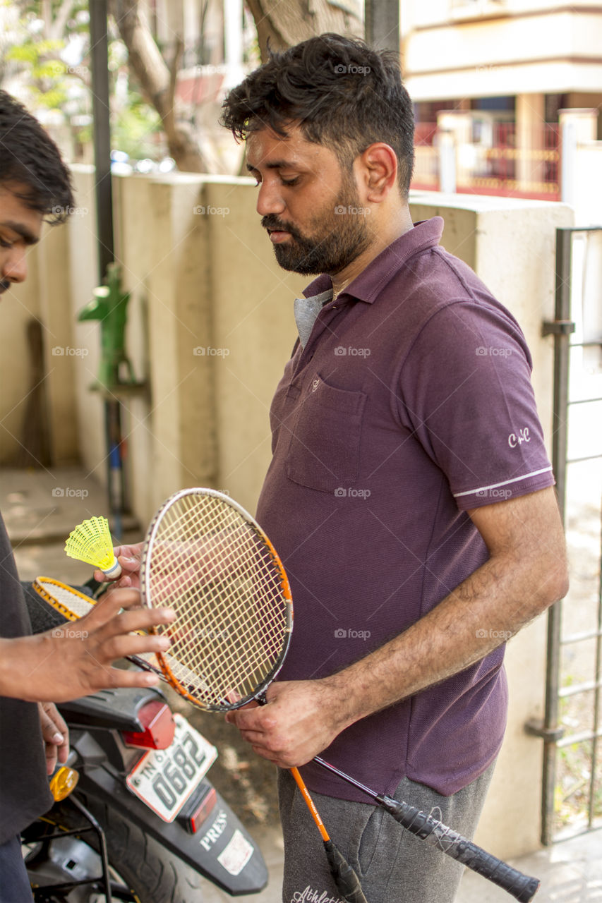 Getting ready to play shuttle badminton