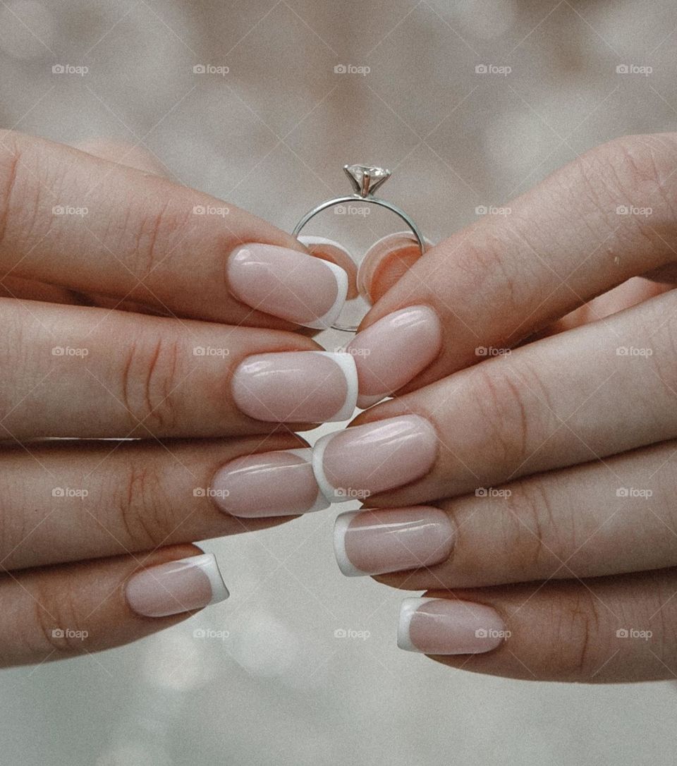 French manicure. Wedding manicure and ring. Wedding day