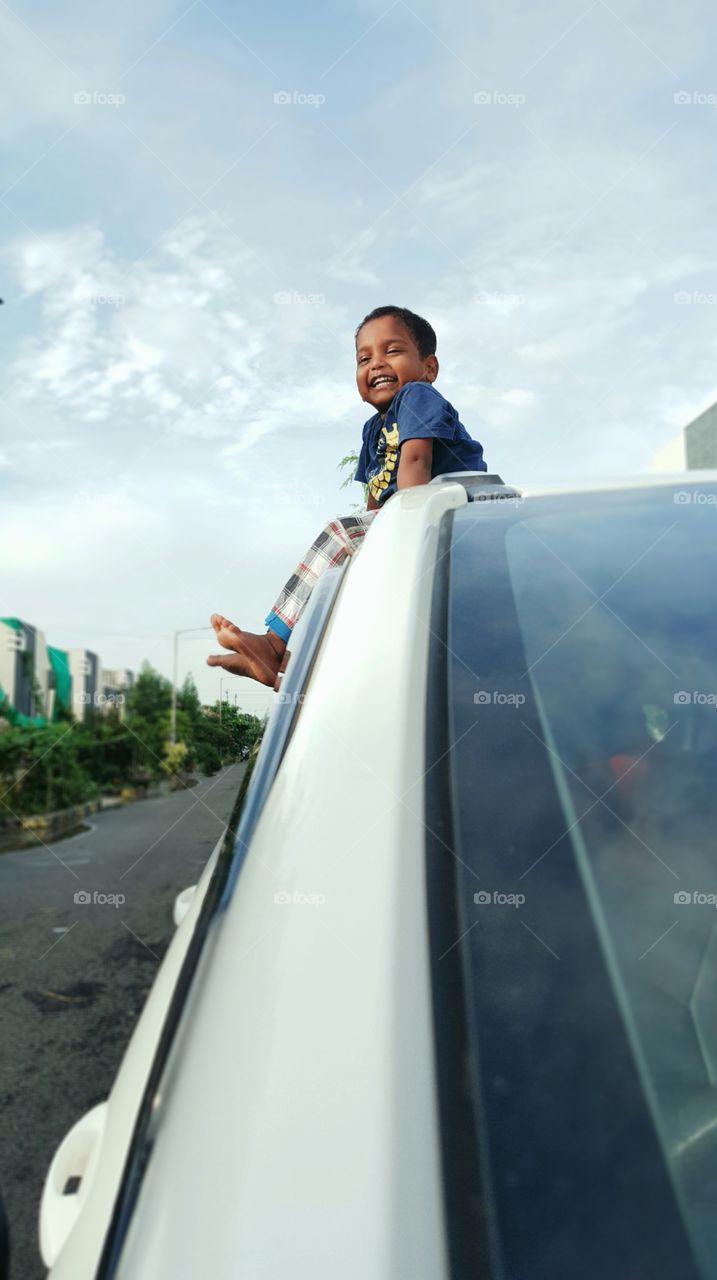 #kid #boy #kidoncar #boy #child #vehicle #street #portrait #outdoor #road #blur #daylight #sky #bluesky #landscape