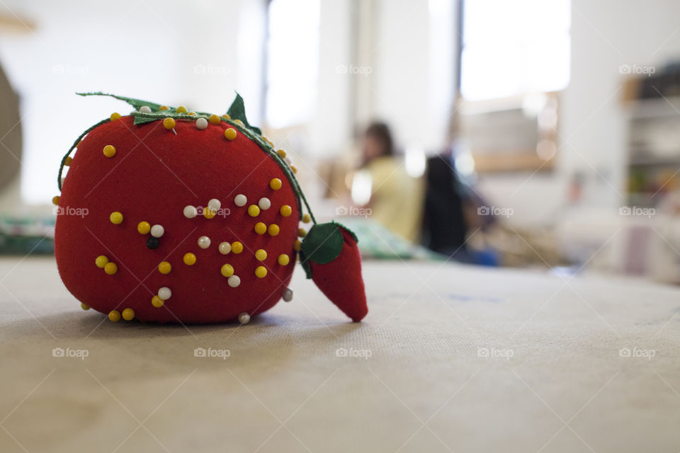 Sew Good. A pin cushion looks on at sewing class. 