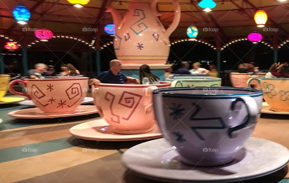 Round and round and round they go.  Mad hatters teacups in the Magic Kingdom in Walt Disney World. 