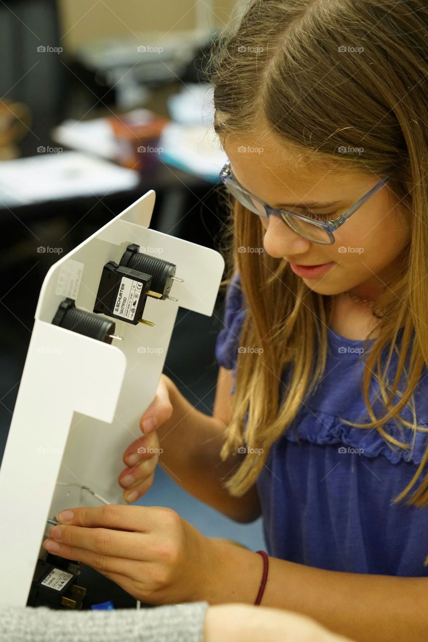 Girl Learning Tech Hands On