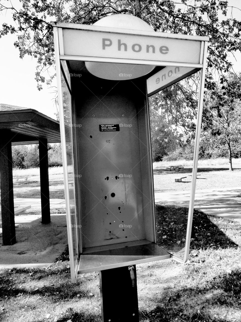 Empty phone booth ... the shell still stands, but no one is answering phone calls from here