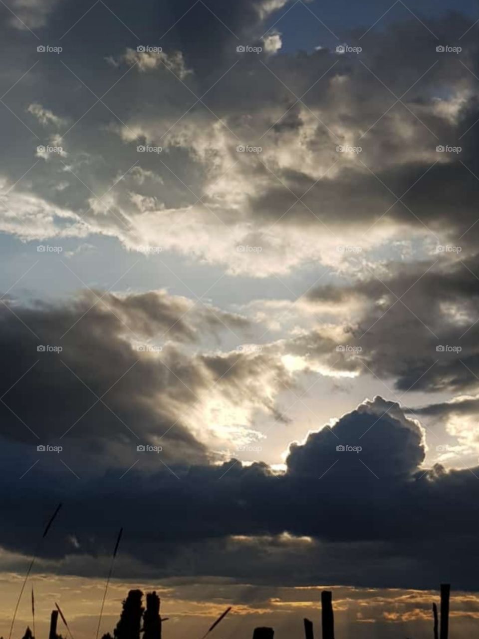 when it's sunny and suddenly the weather starts to change and the clouds darken and it's almost raining