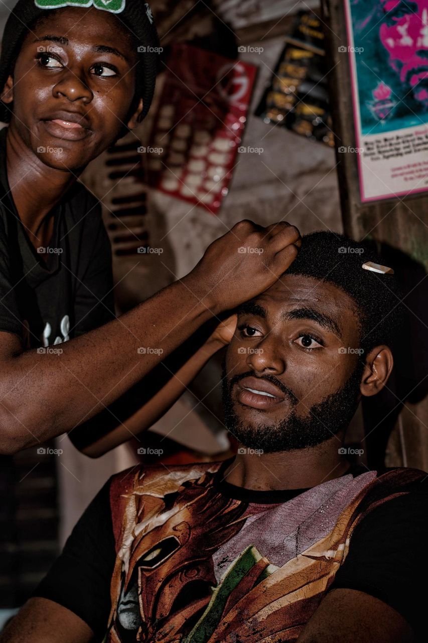 Getting my hair done in a local saloon