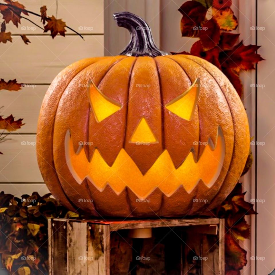 Halloween pumpkin head scary face with evil eyes.