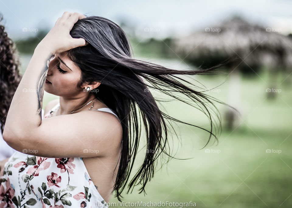 Young woman with wind swept hair