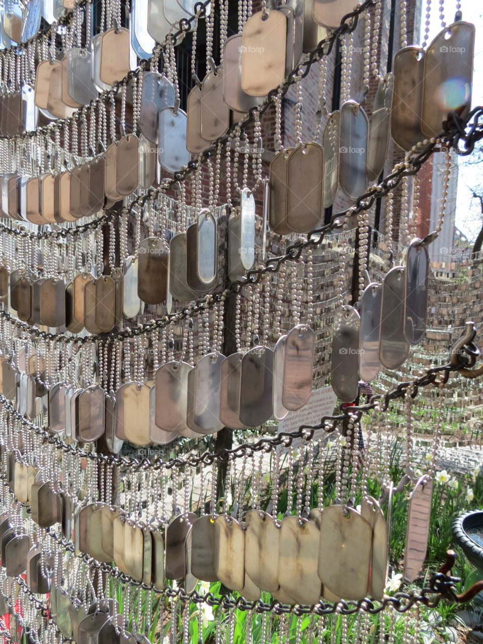 war memorial using dog tags to represent lives lost in battle