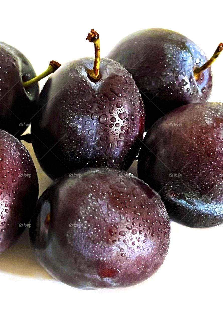 Plums on a white background