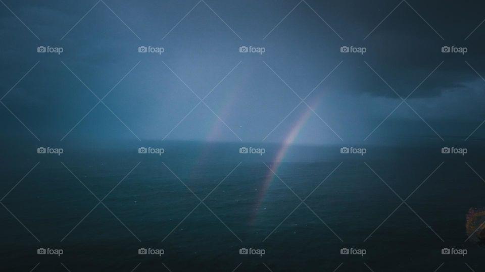 Double rainbow in a gloomy weather 