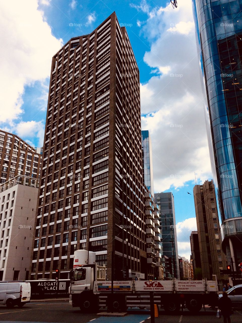 London with the many high rise building. It looks stunning and incredible. All the windows reflecting the blue cloudy sky. Architecture modern and urban style mixt with the traditional buildings. The next trip for you