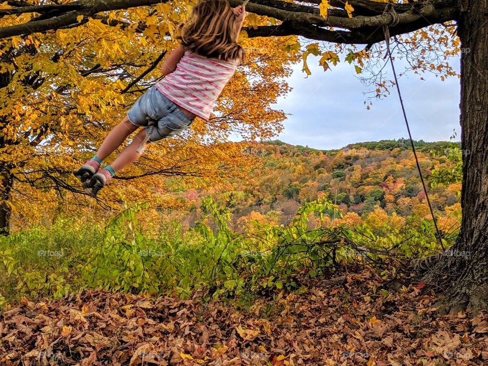 girl on rope swing