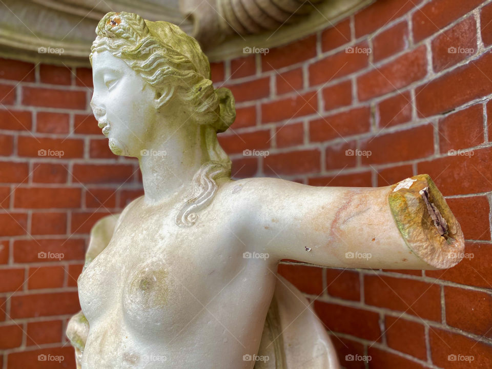 Partly ruined statue at Old Westbury Gardens, Long Island NY