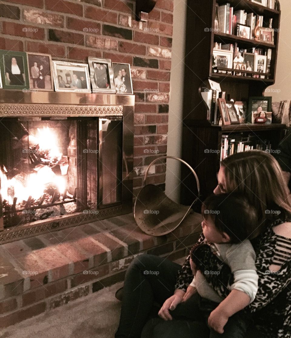 A cool night by the fire place, mom and baby 