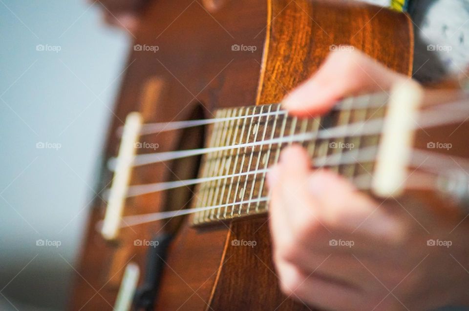 Girl playing the ukulele