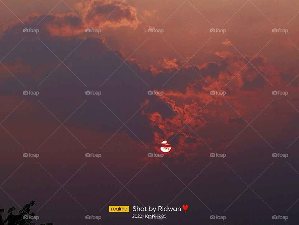 a beautiful sunset captured by mobile.
clouds in sunset moment..