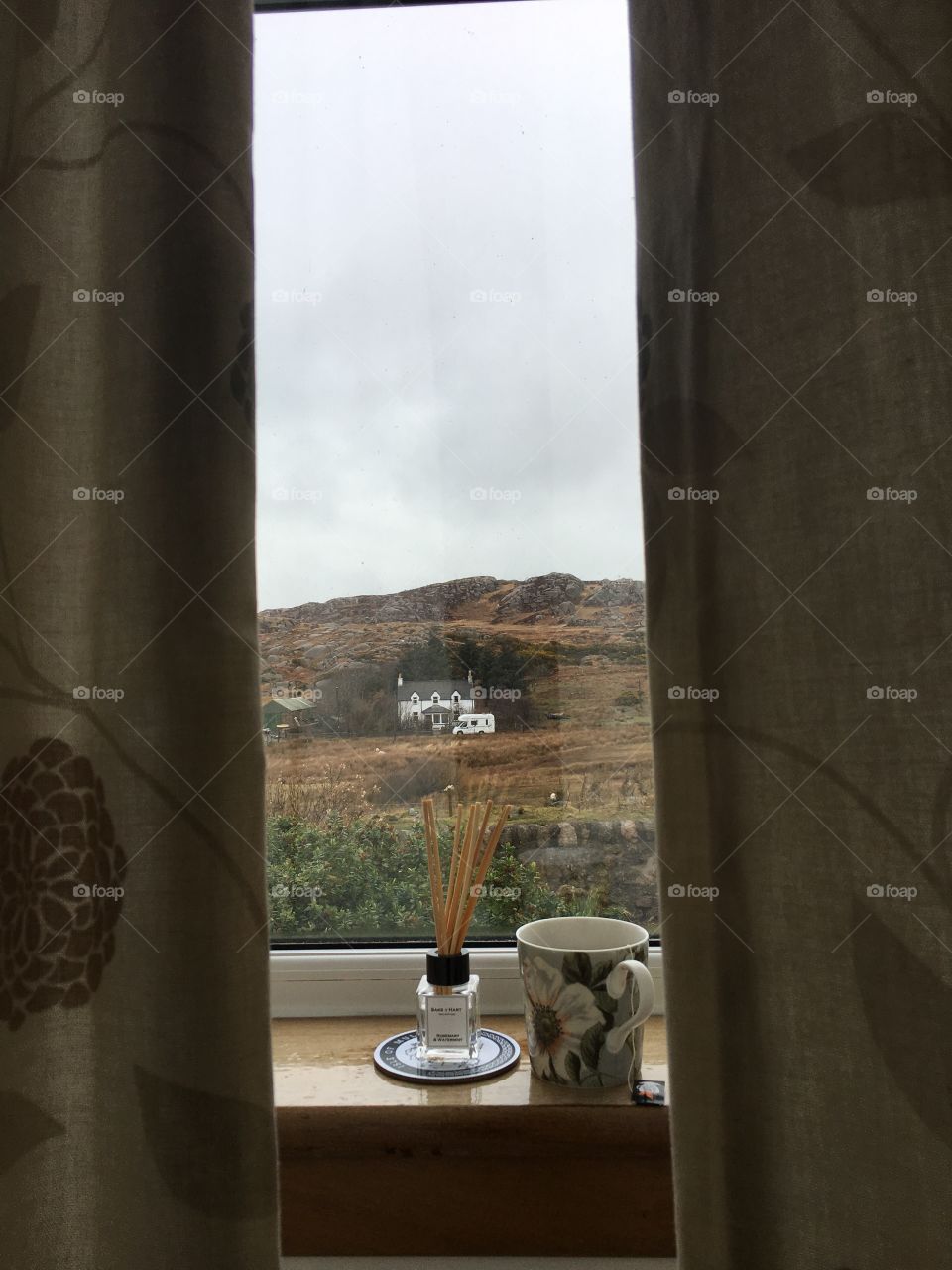 A cozy interior looking out onto the countryside of the Scottish Western Isles
