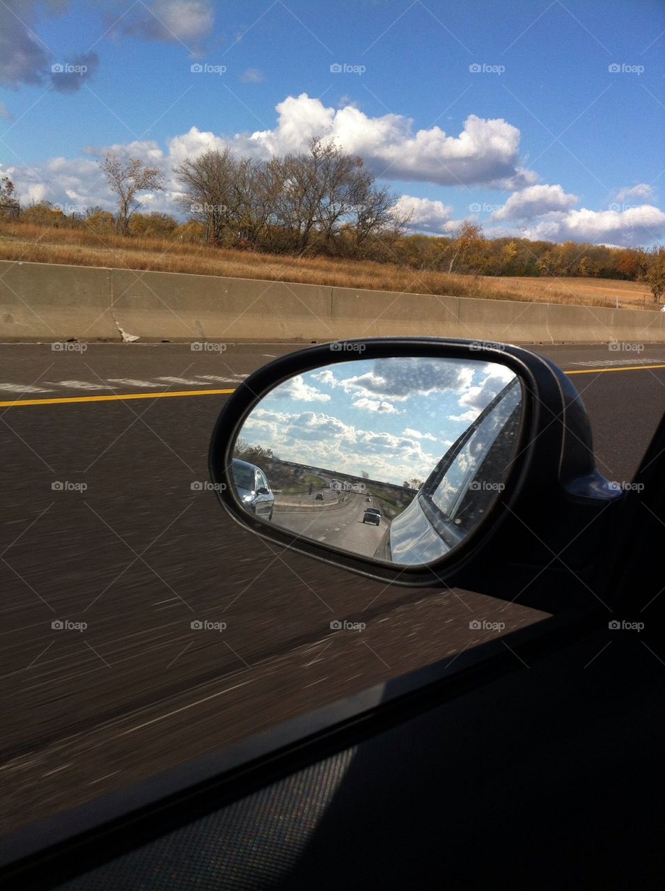 Sky in rear view mirror