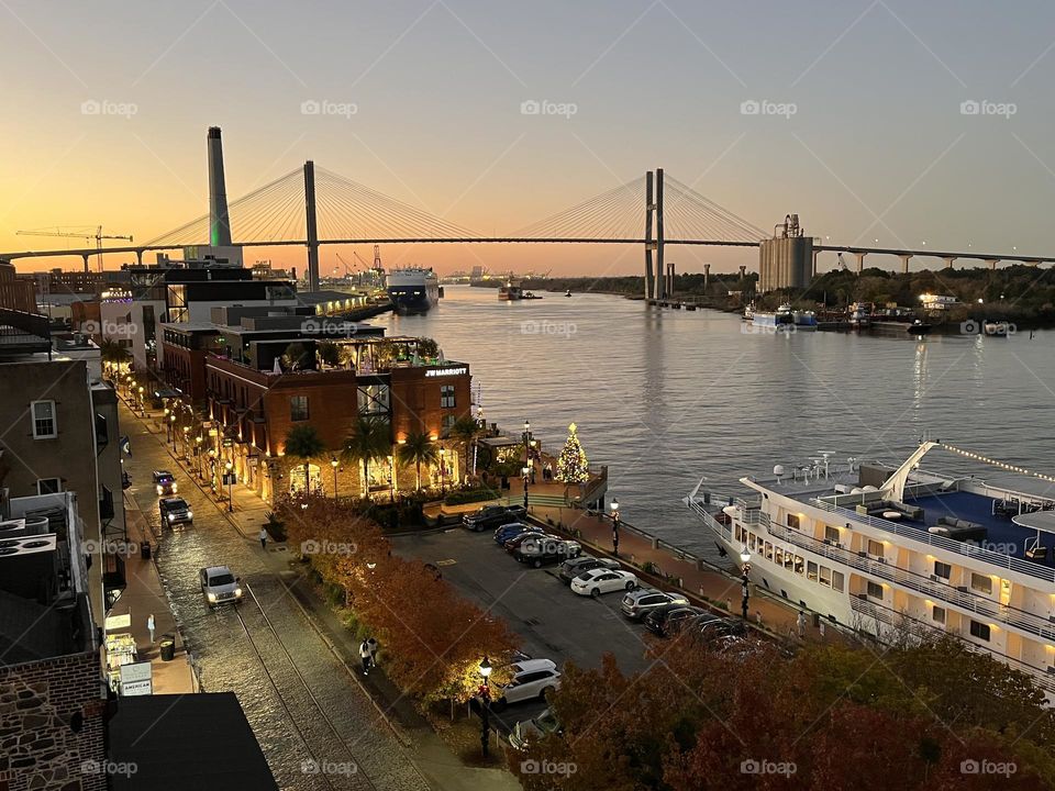 Glowing Savannah sunset overlooking the busy canal