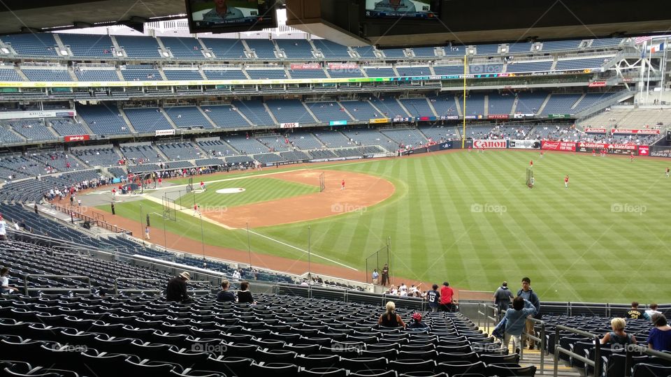 New York Yankees stadium during batting practice before a Major League Baseball game.