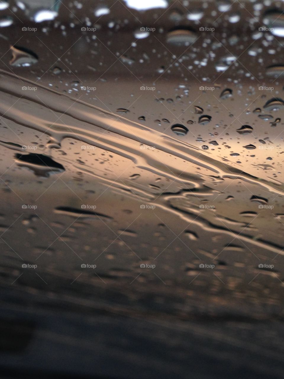 Spring rains. Rain on the windshield of a car 