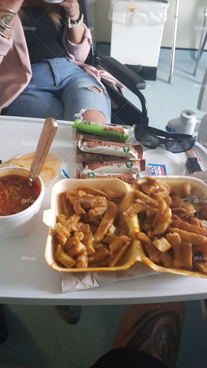 My wife bringing me chips and curry and hot and sour soup while I was in hospital