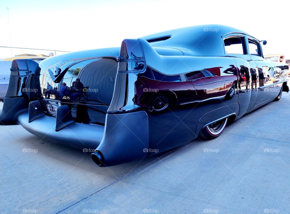 A heavily modified hot rodded 1960's Cadillac is dropped, channeled and bagged with an expensive air ride system
