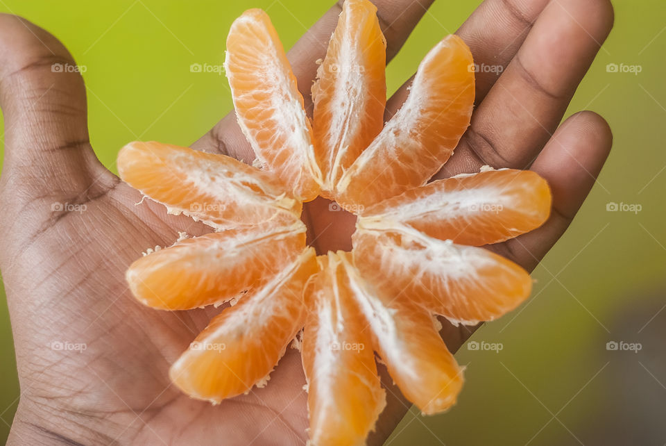 An Orange slices on hand