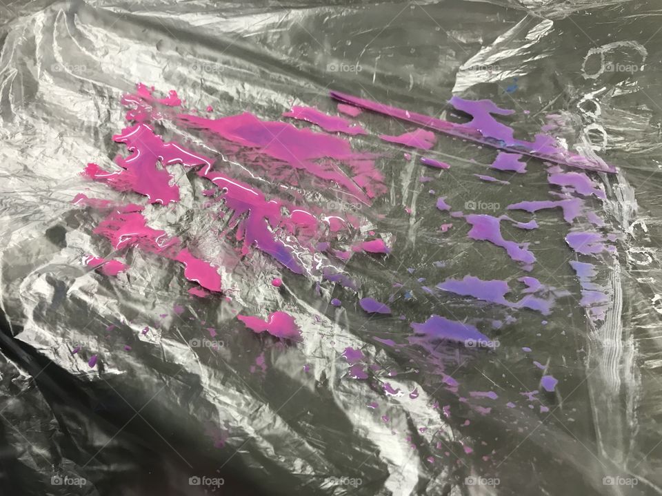 This was made by using pink and purple chalk markers on a piece of plastic then mixing water over it all. 