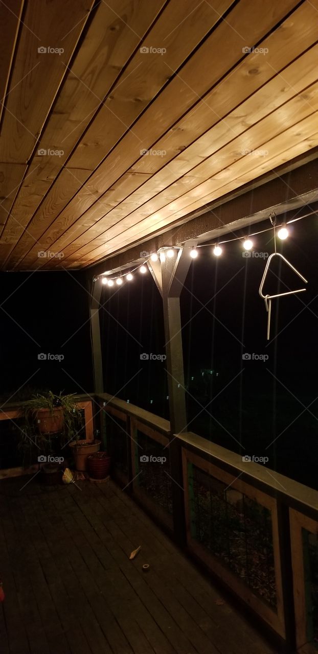 front porch with string lights at night