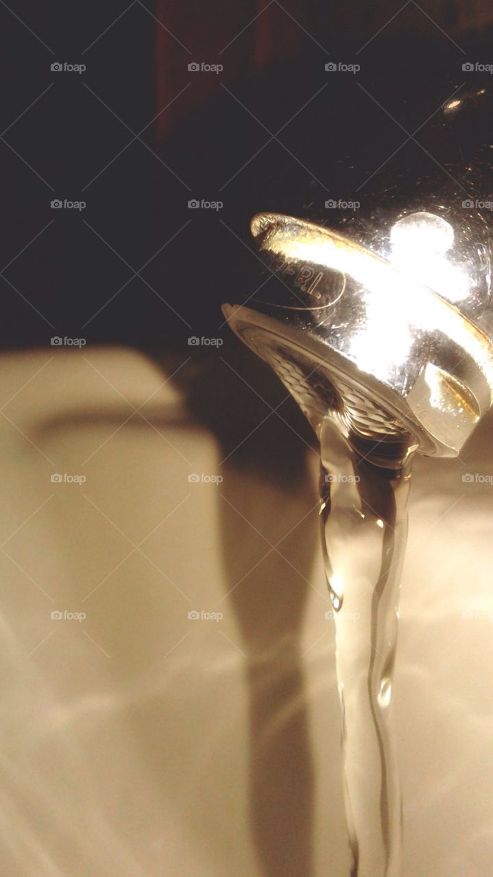 Flowing water in wash basin.