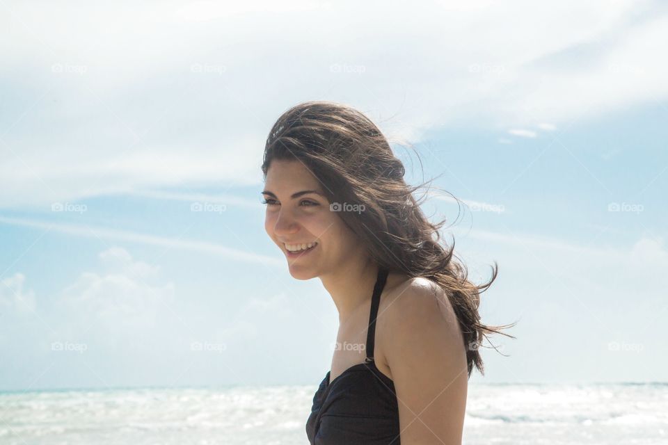 Friend girl with happy smile on a beach