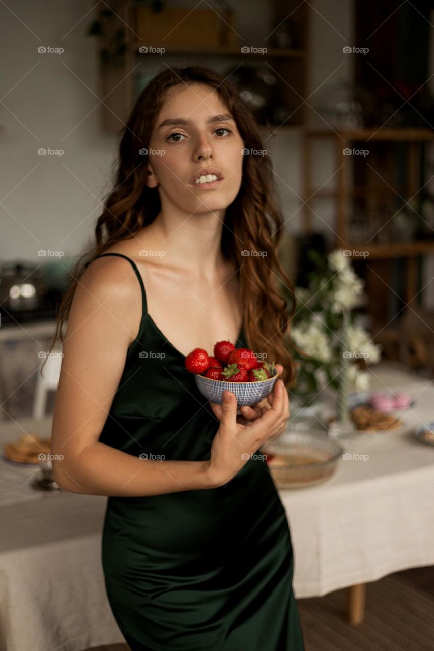 Beautiful girl eat strawberries 