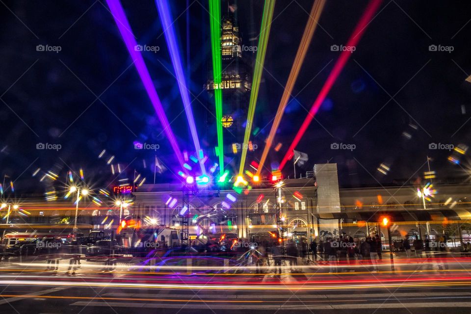 San Francisco pride 2023 light installation of the pride colors looking towards the ferry building as cars zip down the Embarcadero