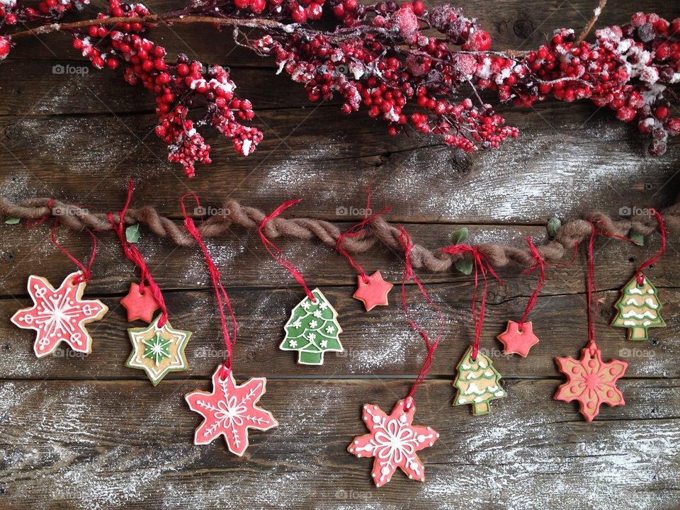 Christmas gingerbread garland on the wooden table