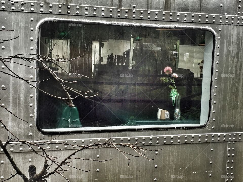 Dining car window on a grey day